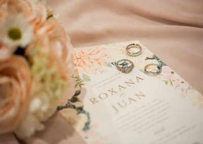 Garden Tuscana Reception Hall event in Mesa showing Roxana and Juan wedding invitations and ring