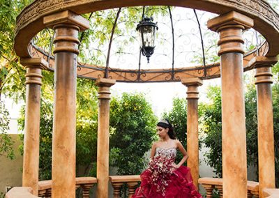 Garden Tuscana Reception Hall event in Mesa showing Quinceanera posing for photos in gazebo at Garden Tuscana
