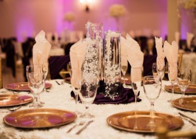 Garden Tuscana Reception Hall event in Mesa showing purple and gold custom table decor in wedding reception