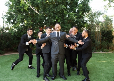 Garden Tuscana Reception Hall event in Mesa showing groomsmen and groom goofy
