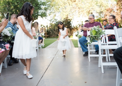 Garden Tuscana Reception Hall event in Mesa showing flower girls in outdoor ceremony