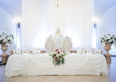 Garden Tuscana provides decorated head table as well as tables for gifts, cake, and signing book.