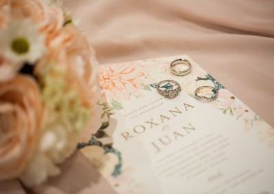 Garden Tuscana Reception Hall event in Mesa showing Roxana and Juan wedding invitations and ring