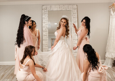 Garden Tuscana Reception Hall event in Mesa showing bride with bridesmaids in suite