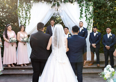 Garden Tuscana Reception Hall event in Mesa showing bride walking down aisle with dad
